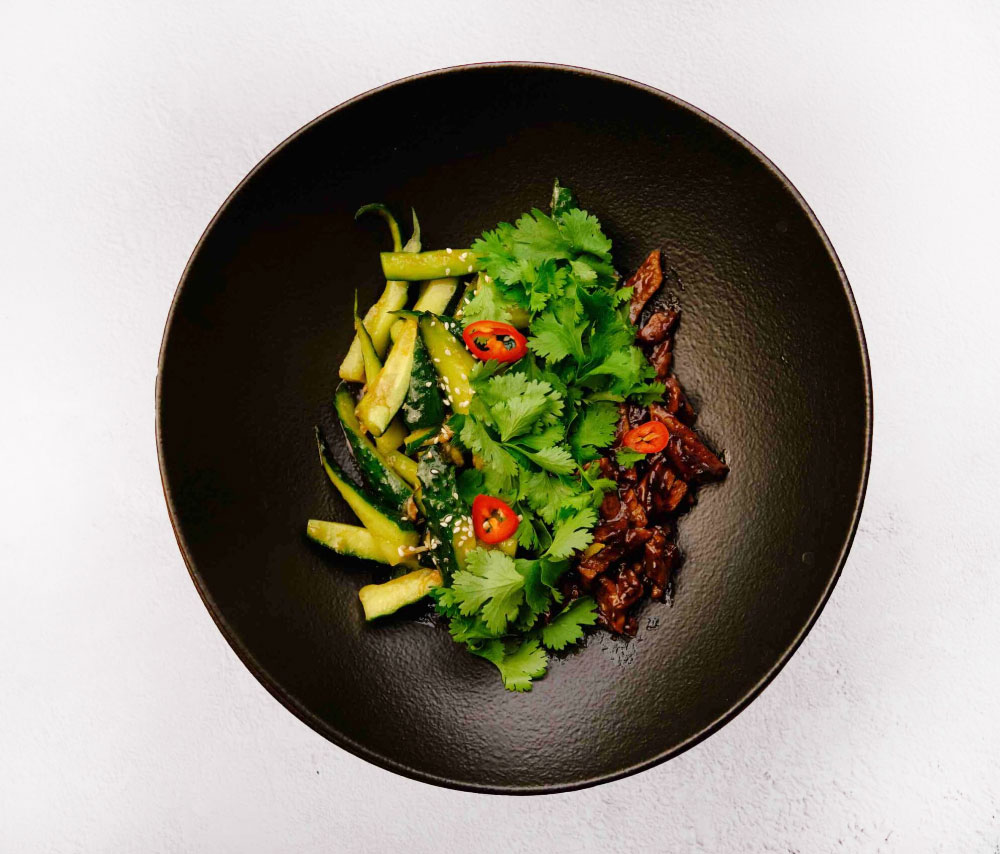Smashed cucumbers with beef tenderloin