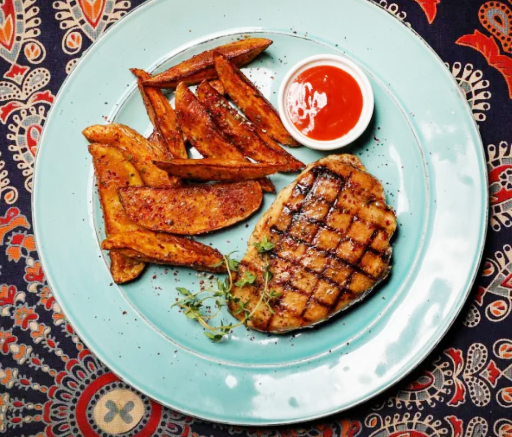 Chicken steak with village potatoes and BBQ sauce Epicure