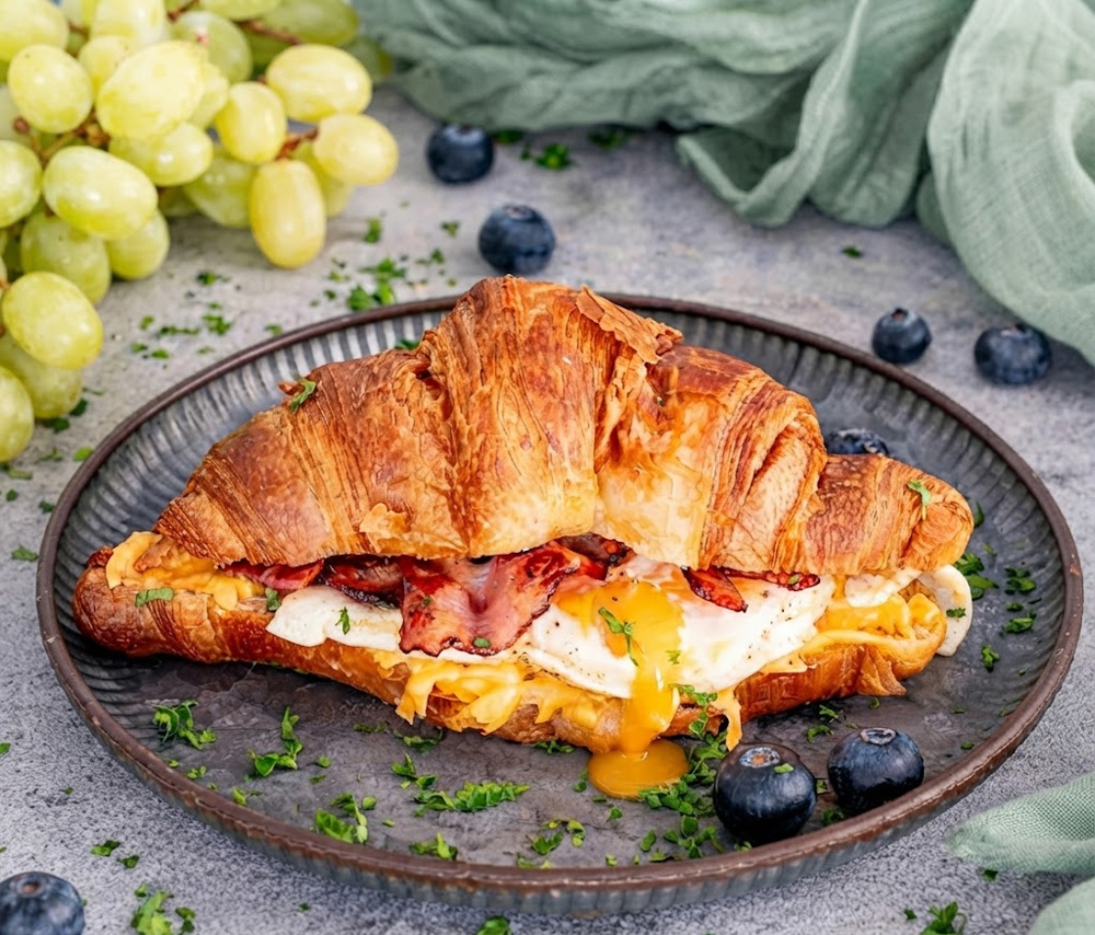 Croissant with bacon and egg